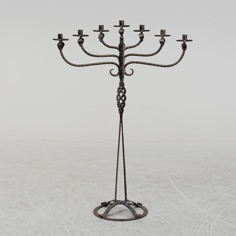 A wrought iron Swedish folk art candle holder.