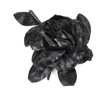 453. YVES SAINT LAURENT, a black brooch.