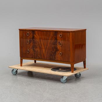 A 1940s Swedish Modern mahogany veneered chest of three drawers.