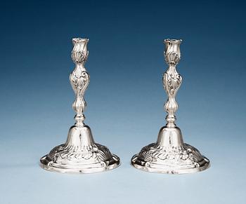 A pair of German mid 18th century silver candelsticks, marked IHG, probably Göttingen.