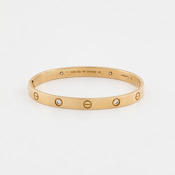 CARTIER, Love bracelet with four brilliant cut diamonds ca 0.40 ct in total.