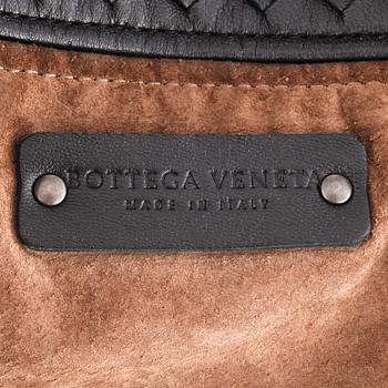 BOTTEGA VENETA, a black woven leather tote bag.