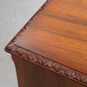 A mid 20th century walnut veneered bar cabinet.