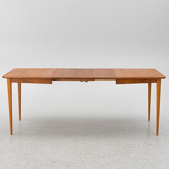 A mid20th century dining table.