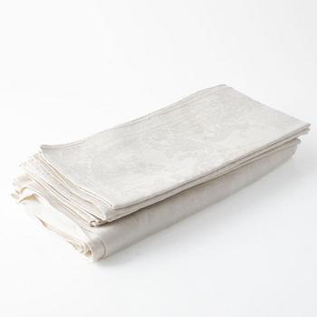 A linen tablecloth and five napkins.