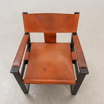 A 1960s leather easy chair.