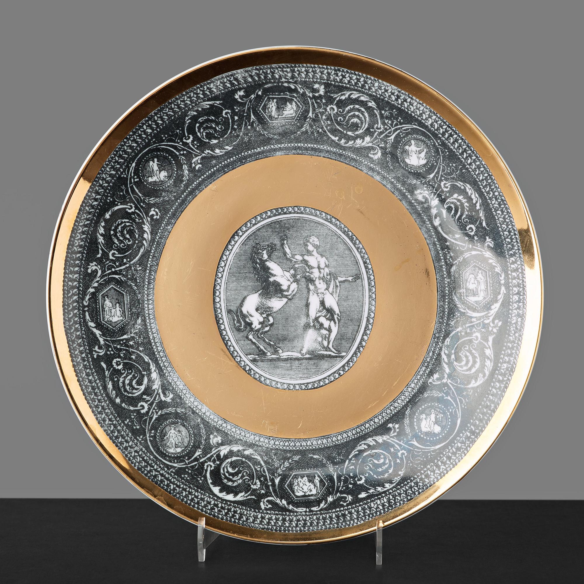 Piero Fornasetti, a set of six "Cammei" porcelain plates, Milano, Italy.