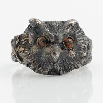 Ring in the form of an owl, silver with orange stone.