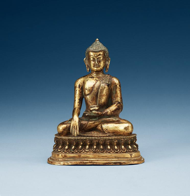 A seated bronze Akshobhya Buddha, late Qing dynasty.