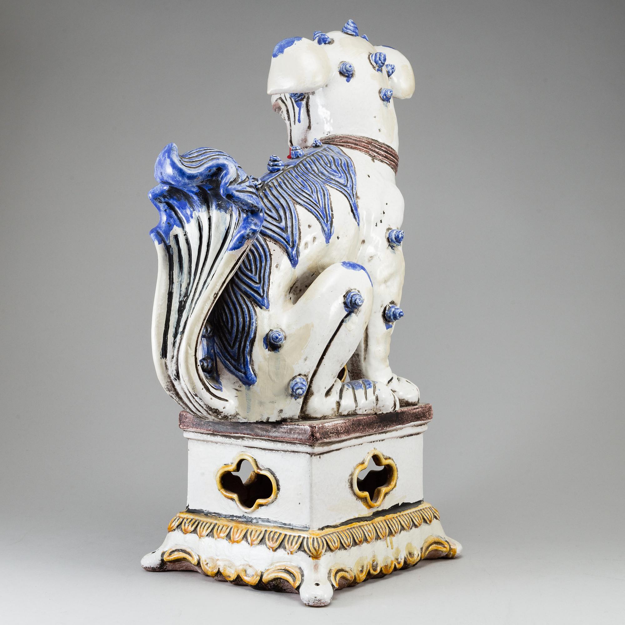 A large Chinese ceramic tile sculpture of a buddhist lion, 20th century.