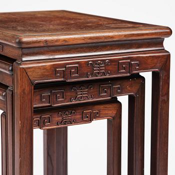 A Chinese hardwood three piece nesting table, early 20th century.