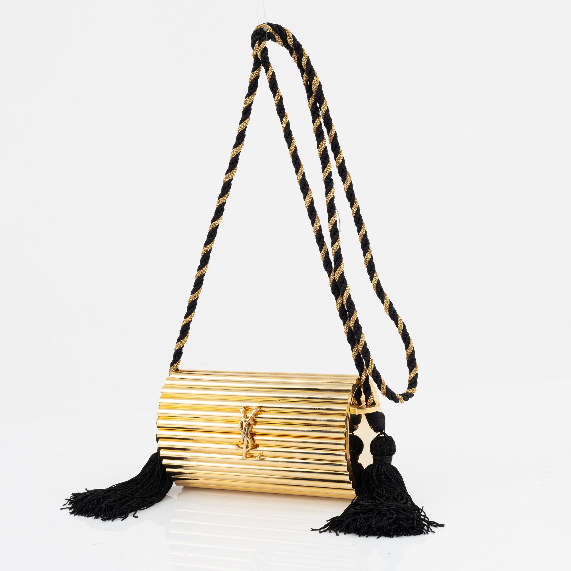 Yves Saint Laurent a Minaudiere Opium evening bag vintage. Bukowskis