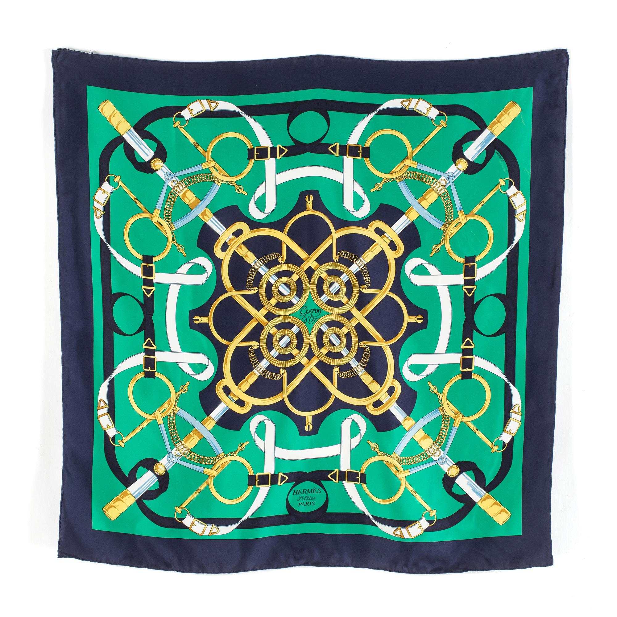 A silk scarf by Hermès "Eperon d'Or".