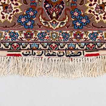 A semi-antique Isfahan rug, central Persia, signed c. 238 x 165 cm.