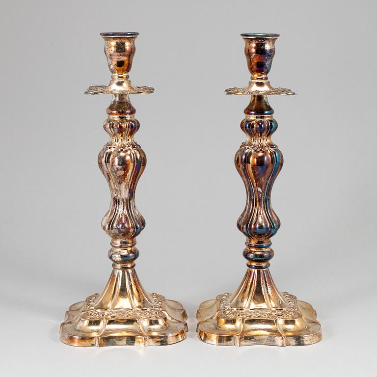 A pair of silver plated candlesticks.