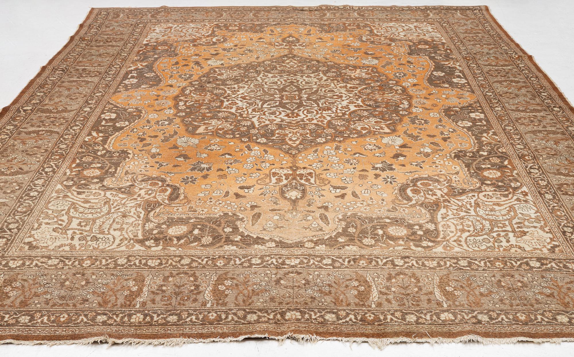 An antique Tabriz carpet, Northwest Persia, 453 x 310 cm.