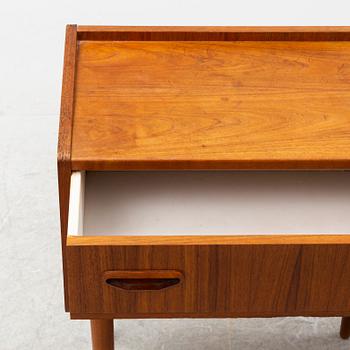 A pair of teak bedside tables, second half of the 20th Century.