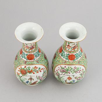 A pair of famille rose canton vases, early 20th century.