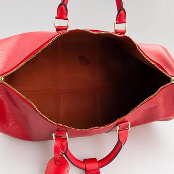 Louis Vuitton, A Red Epi Leather Keepall travel bag.