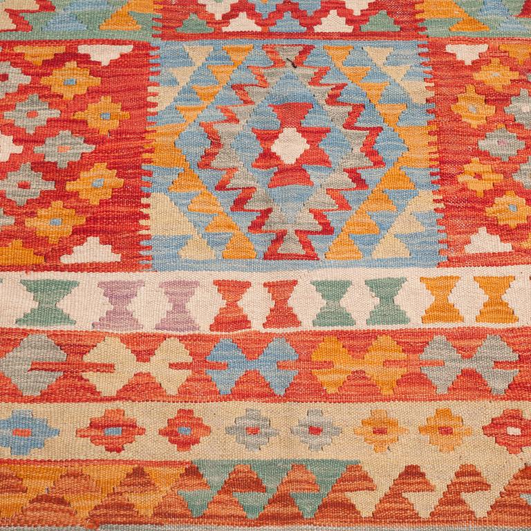 A kelim rug, 303 x 205 cm.