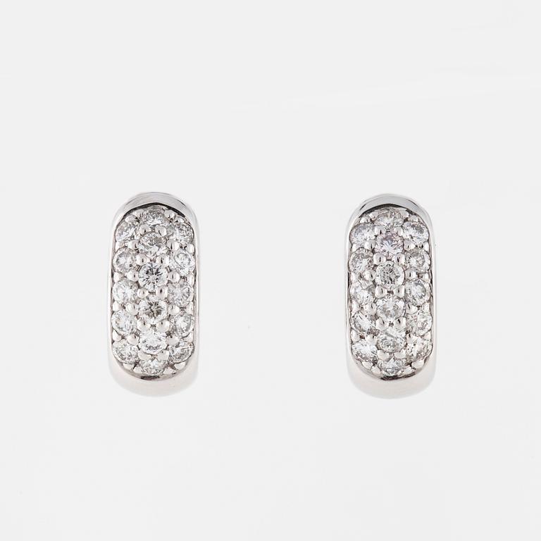 A pair of brilliant cut diamond earrings..