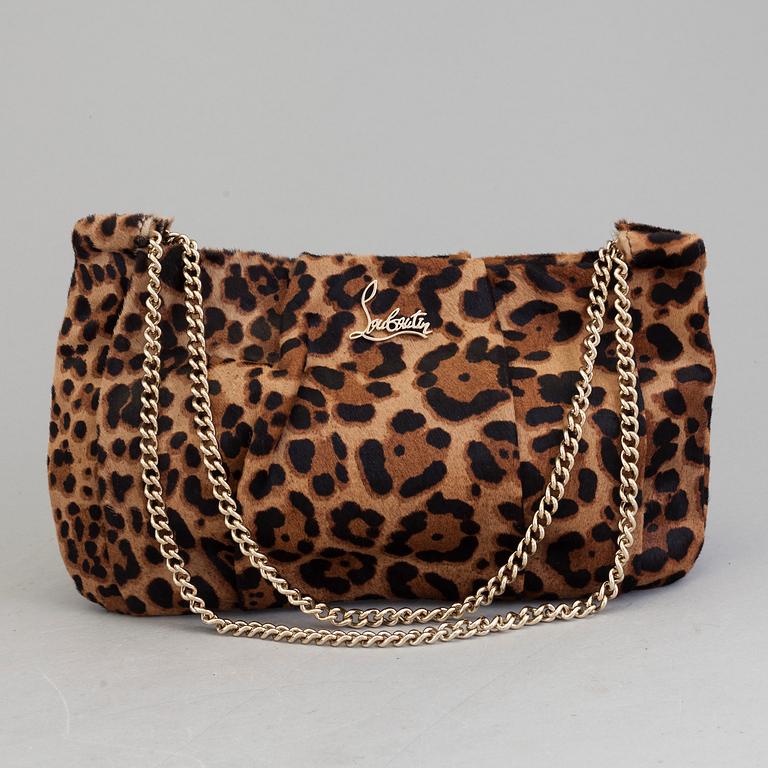 A leopard patterned ponyhair handbag by Christian Louboutin.