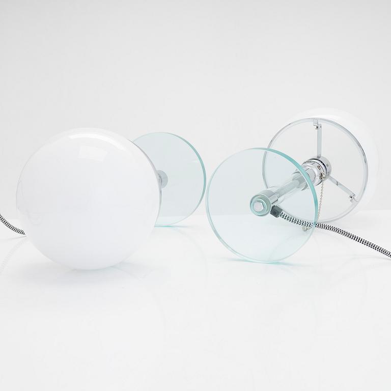 Wilhelm Wagenfeld, a pair of Bauhaus style 'WG24' table lights, Egoluce, Italy, 2000s.