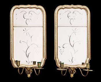 1257. A pair of Swedish Rococo 18th century two-light girandole mirrors.