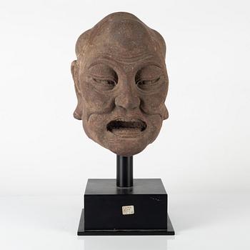 A carved stone head of a Luohan, Ming style but later.
