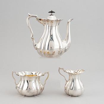 A swedish parcel-gilt coffee pot, creamer and suga bowl.