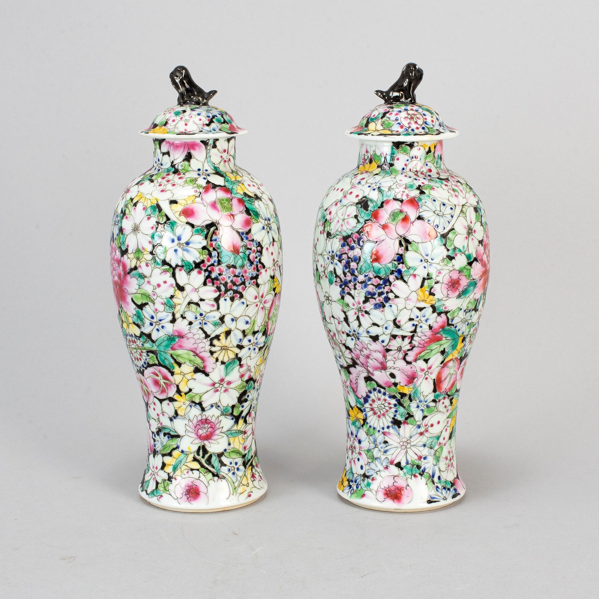 A pair of Chinese 'Mille fleur' porcelain vases with covers, 20th century.