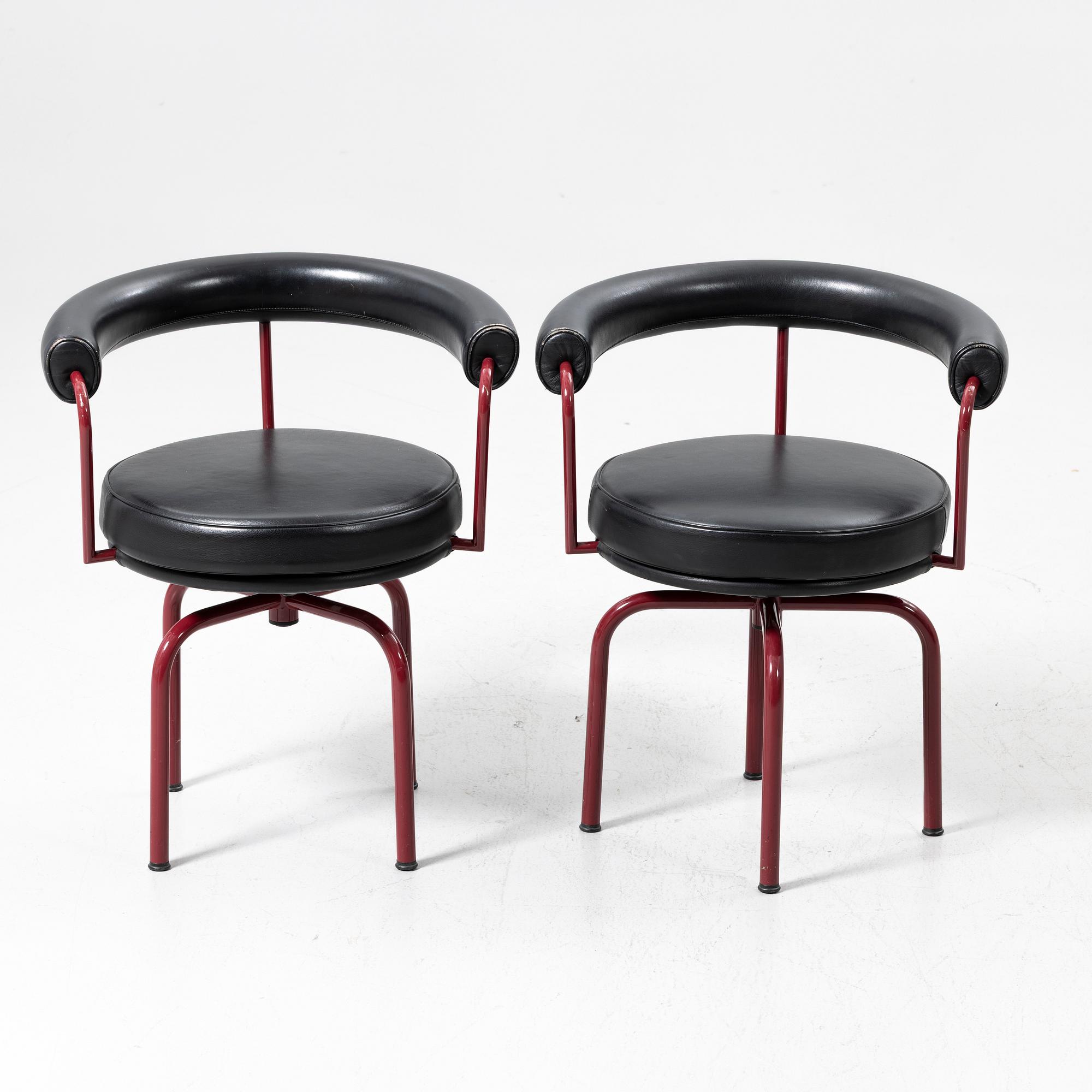 Charlotte Perriand, /Le Corbusier, swivel armchairs, a pair, model LC7, Cassina, Italy, latter half of the 20th century.