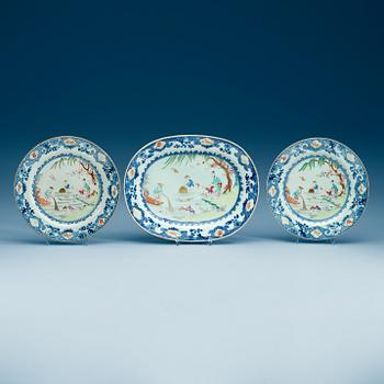 1535. A famille rose serving dish and two dinner plates, Qing dynasty, Qianlong (1736-95).