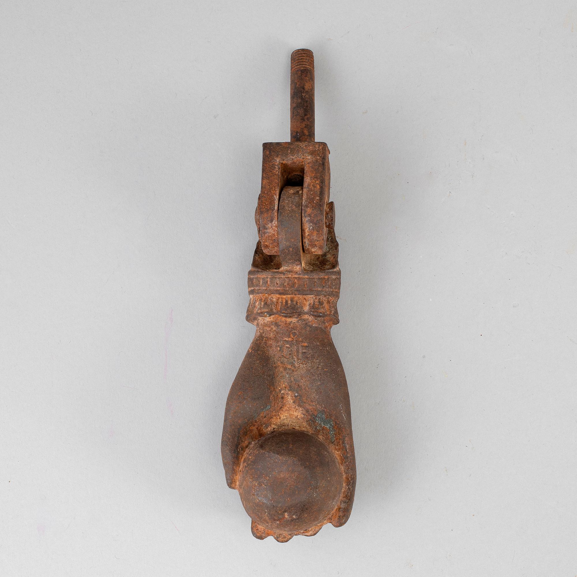 A 19th century cast iron dorr knocker.