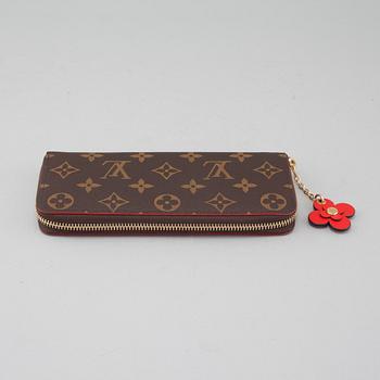 LOUIS VUITTON, a "Clémence" wallet.