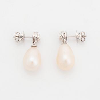 A pair of 18K white gold and cultured pearl earrings set with round brilliant-cut diamonds.