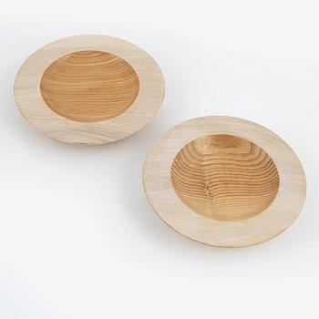 Magnus Ek, a set of four ash wood plates for Oaxen Krog, 2020.