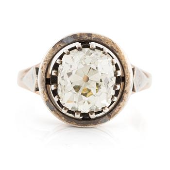 525. A 14K gold and silver ring with an old-cut diamond.