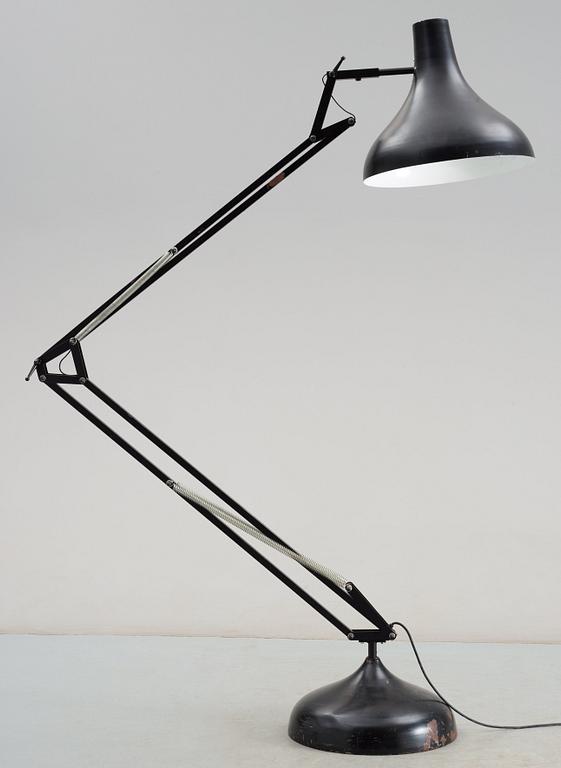 A black lacquered metal industrial floor lamp, Germany 1950's-60's.