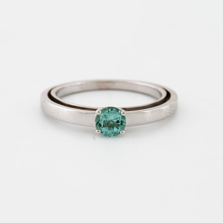 A tourmaline and brilliant cut diamond ring.