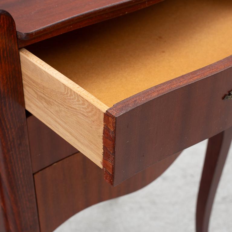 A pair of Rococo style bedside tables, second half of the 20th Century.