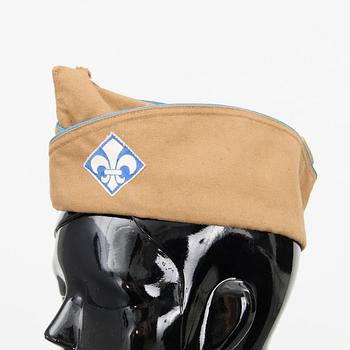 Two Finnish girl scouts uniforms with accessories and a boardgame, mid-second half of 20th Century.