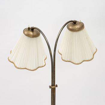 A brass floor lamp, mid 20th Century.