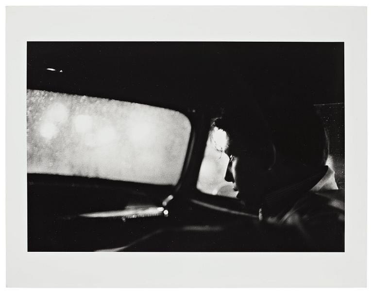 Larry Clark, "Untitled (man in car with view of rainy night)", 1963.
