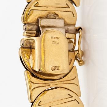 A 14K white and yellow gold bracelet.