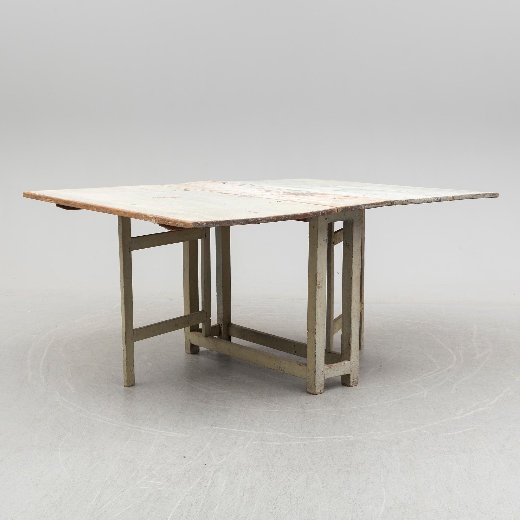 a gate-legged table from the first half of the 19th century.