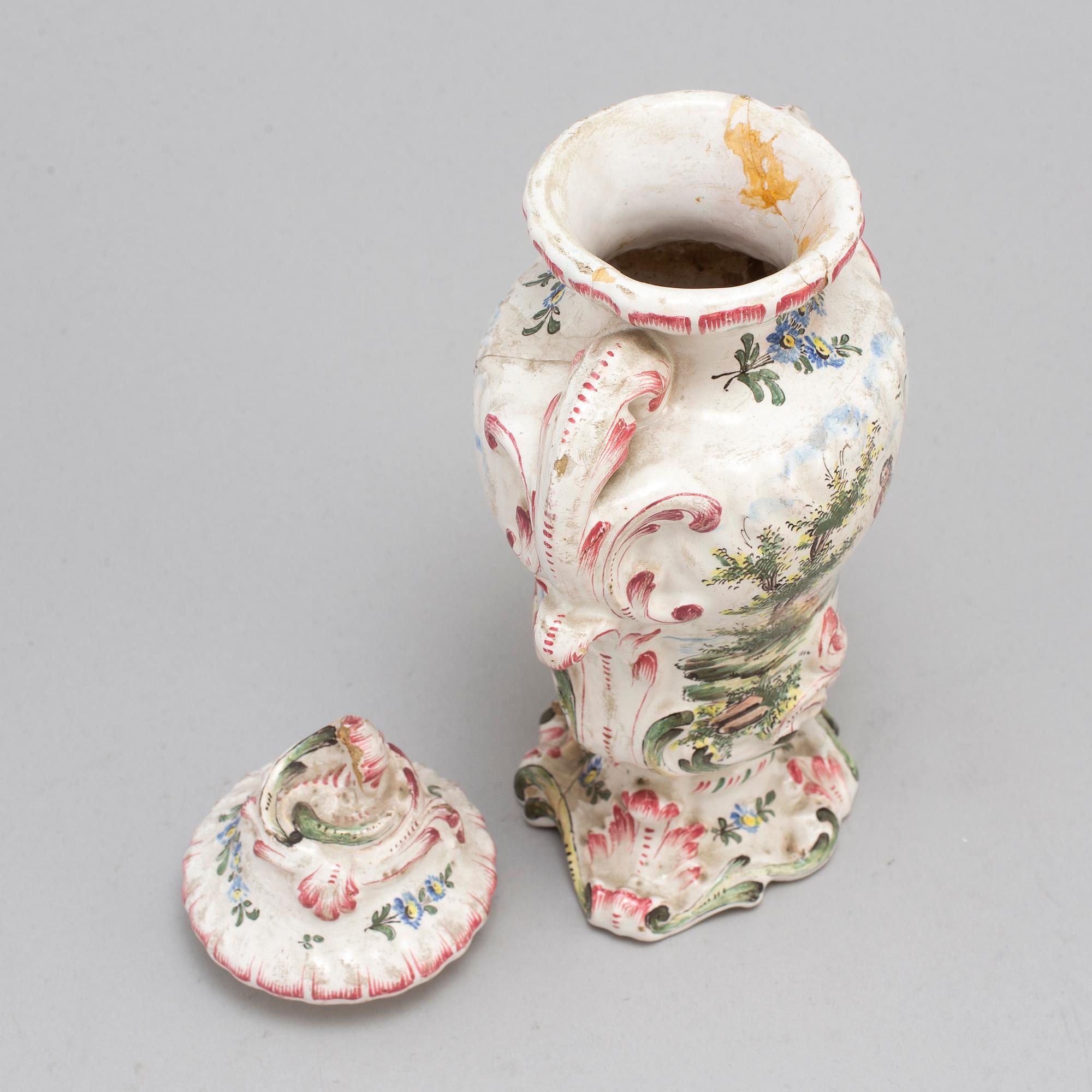 A Rococo faiance vase with cover, mid 18th century.