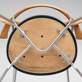 Hans J. Wegner, a set of six "JH-701" oak and black leather chairs by Johannes Hansen, Denmark.