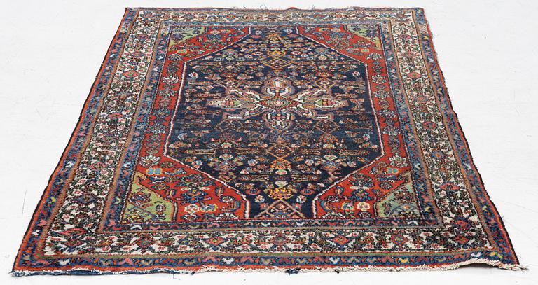 An oriental, semi-antique rug, c. 195 x 130 cm.