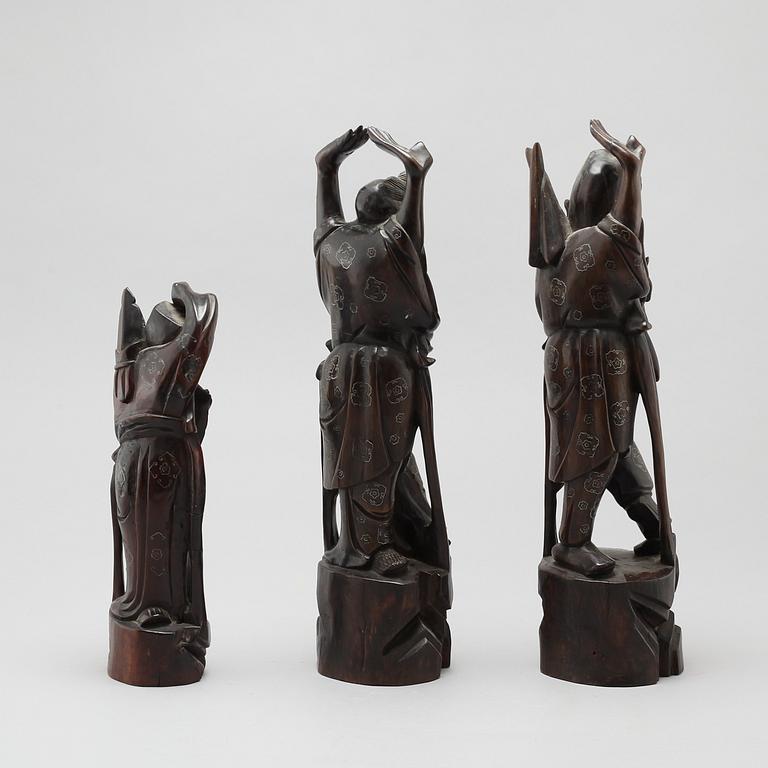 Three chinese wooden sculptures, 20th century.